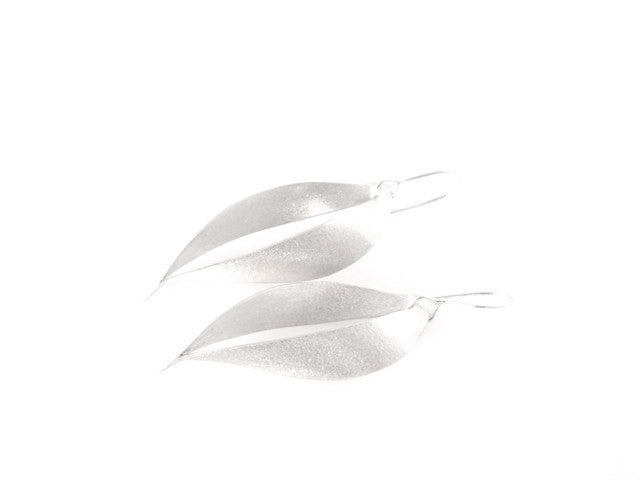 Flow earrings are made from sterling (anti-tarnish) silver. They are a sculptural, wonderful shape, one of my own personal favourites to wear.