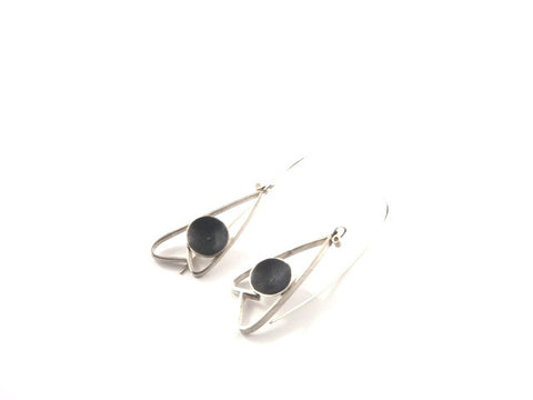 Grey moth earrings by Tasmanian designer and maker Janine Combes. They are made from sterling silver.